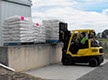 wrapped pallets being loaded with a forklift at Frances seeds